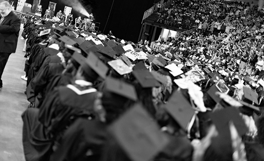 Black and white image of students in regalia at the Penn Foster 2024 graduation ceremony in Atlanta, GA.