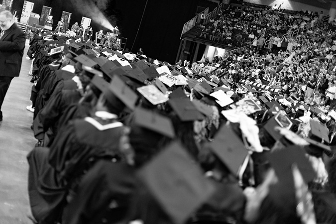 Black and white image of students in regalia at the Penn Foster 2024 graduation ceremony in Atlanta, GA.