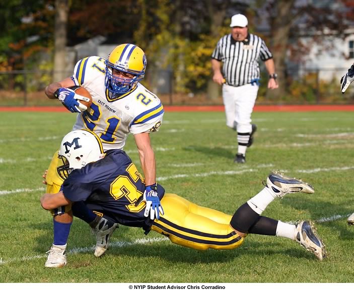 A fast shutter speed is used to freeze a diving tackle.