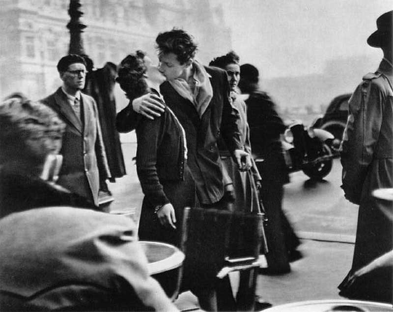 “The Kiss in Front of the Hotel de Ville”, by Robert Doisneau. It's grainy, very blurry in places, and there's a woman's head growing out of the man's shoulder, but that doesn't stop it being an awesome photo.